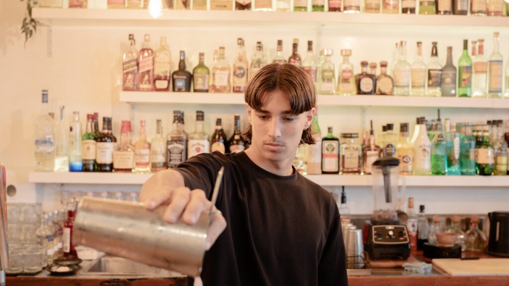 A bartender pouring cocktails at Baskk, the Best bar in Gold Coast & Best restaurant in Coolangatta.