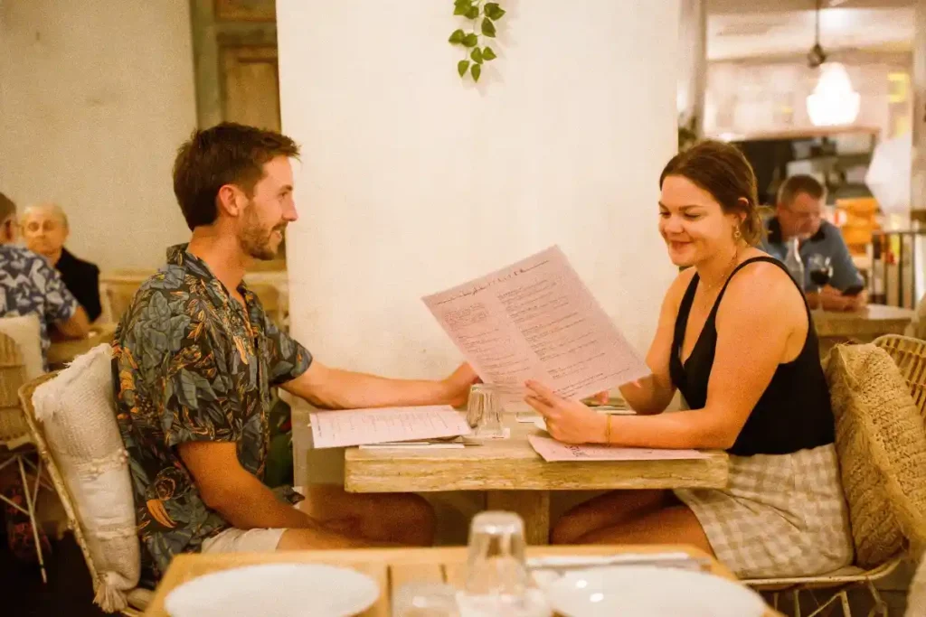 Couple enjoying dinner at Baskk, the best restaurant in Coolangatta and best bar in Gold Coast, with a relaxed vibe.