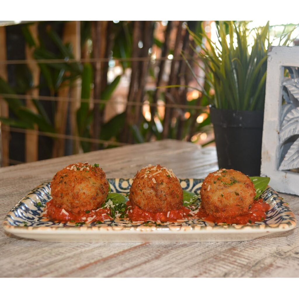 Crispy arancini balls served with tomato sauce at Baskk, the best restaurant in Coolangatta and best bar in Gold Coast.